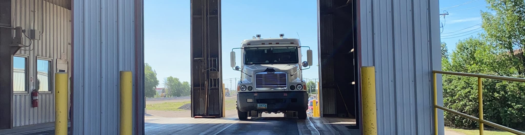 Semi truck pulling into a garage
