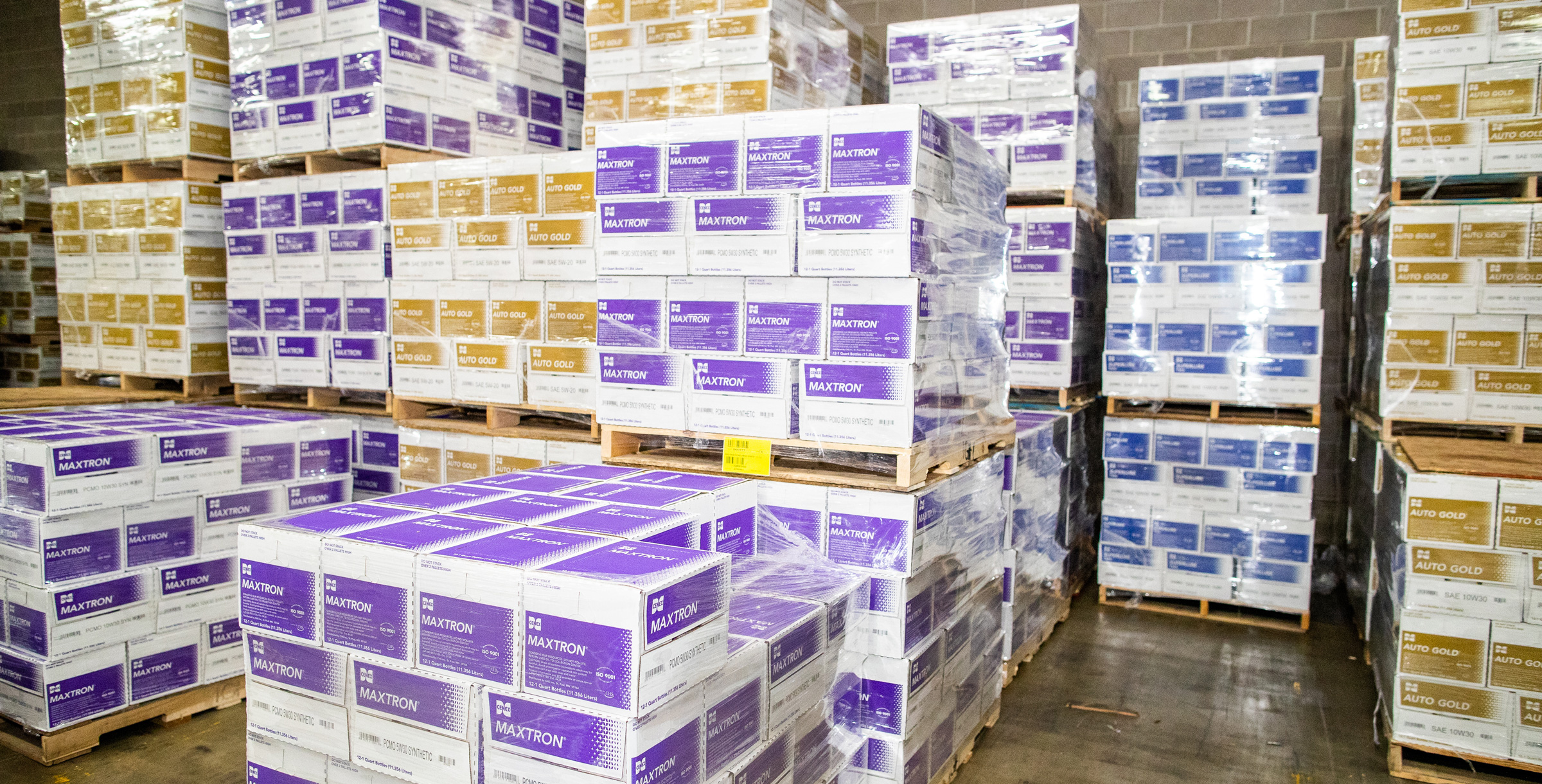 Pallets holding Cenex Maxtron and Auto-Gold product boxes